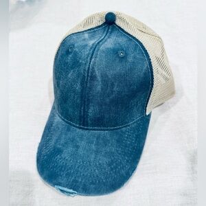 Plain women’s blue jean trucker hat. White mesh cap back.